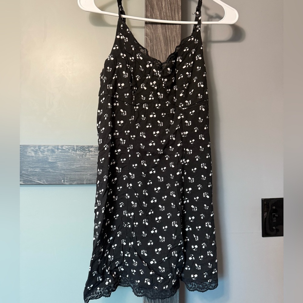 Adorable mini dress with mushrooms and lace details. Size XS.